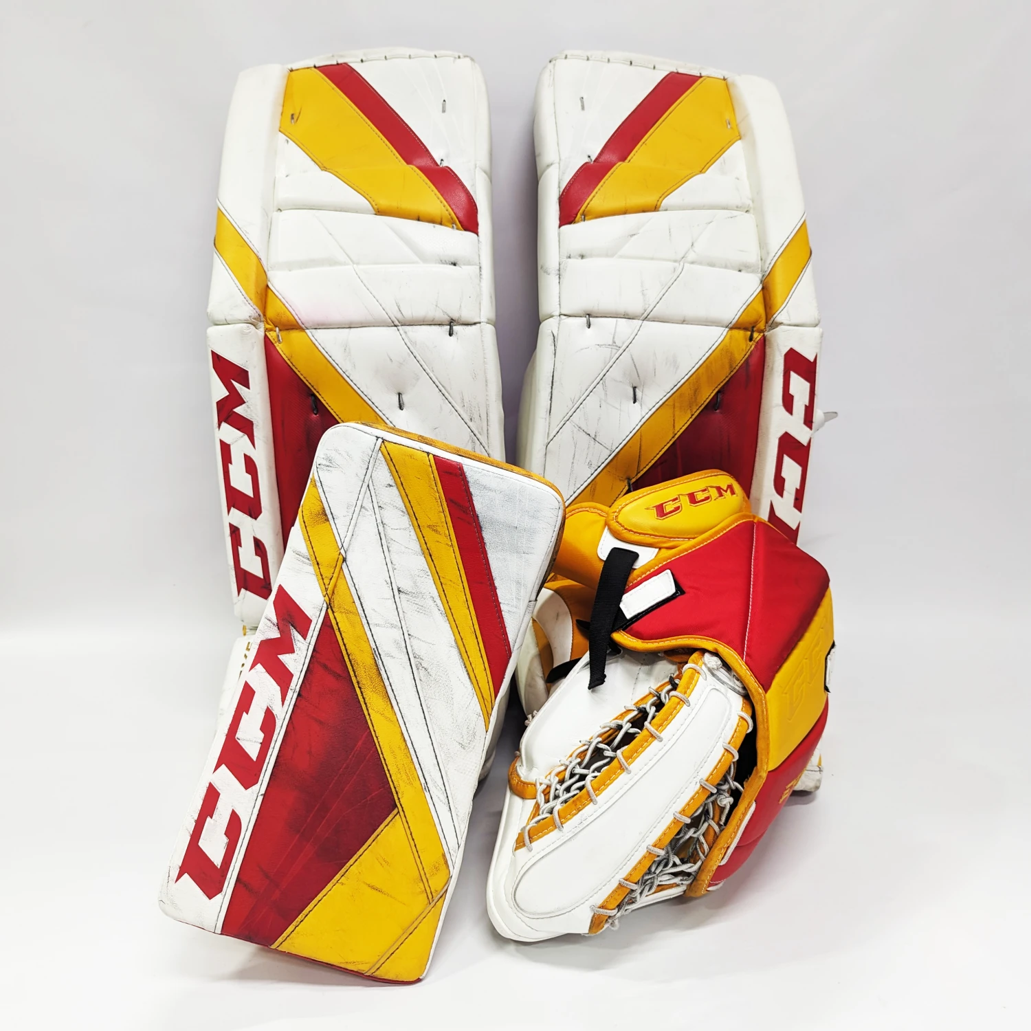 CCM Extreme Flex 5 - Used AHL Pro Stock Goalie Pads (White/Red/Yellow) 1 CCM Extreme Flex 5 - Used AHL Pro Stock Goalie Pads (White/Red/Yellow)