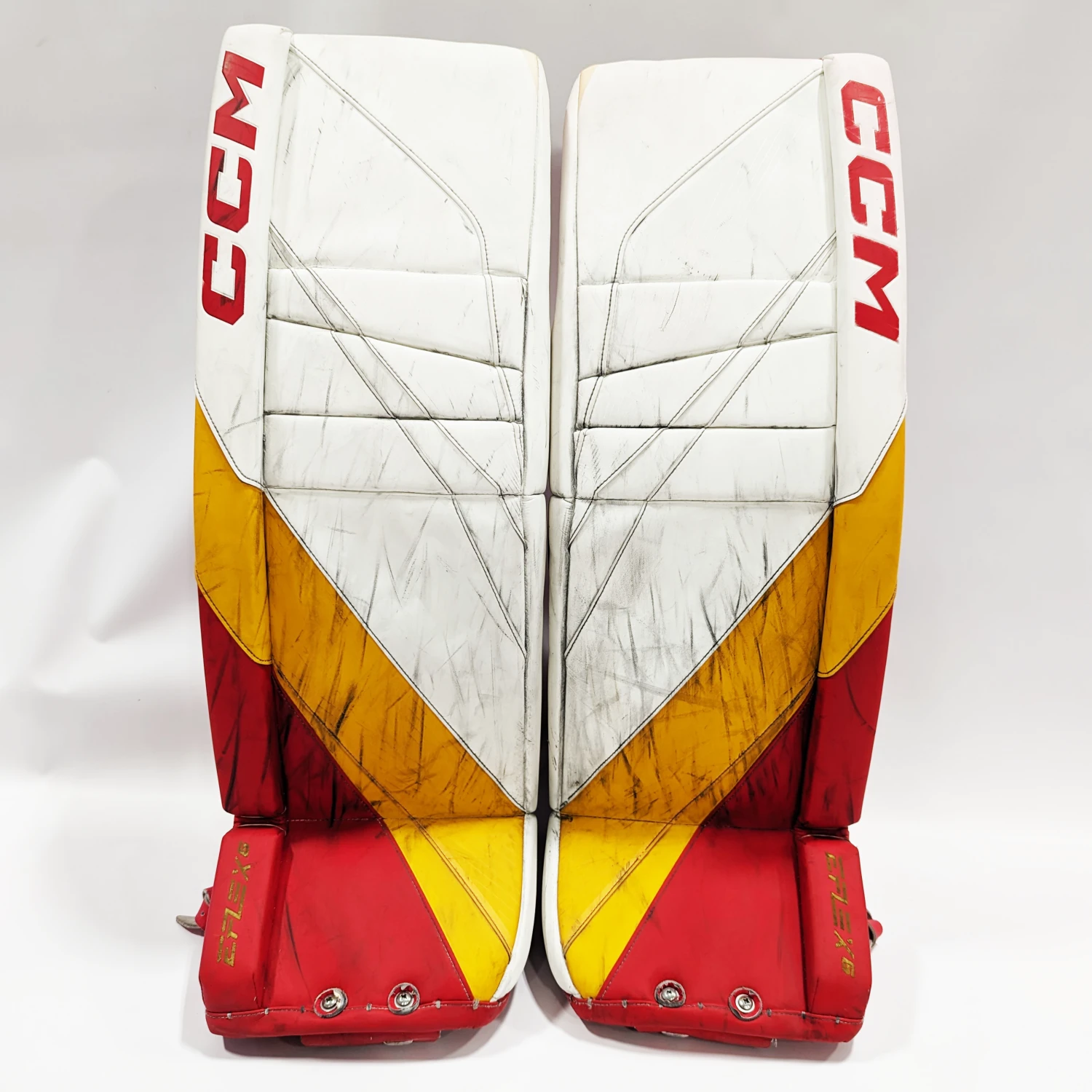 CCM Extreme Flex 6 - Used AHL Pro Stock Goalie Pads (White/Red/Yellow) 1 CCM Extreme Flex 6 - Used AHL Pro Stock Goalie Pads (White/Red/Yellow)